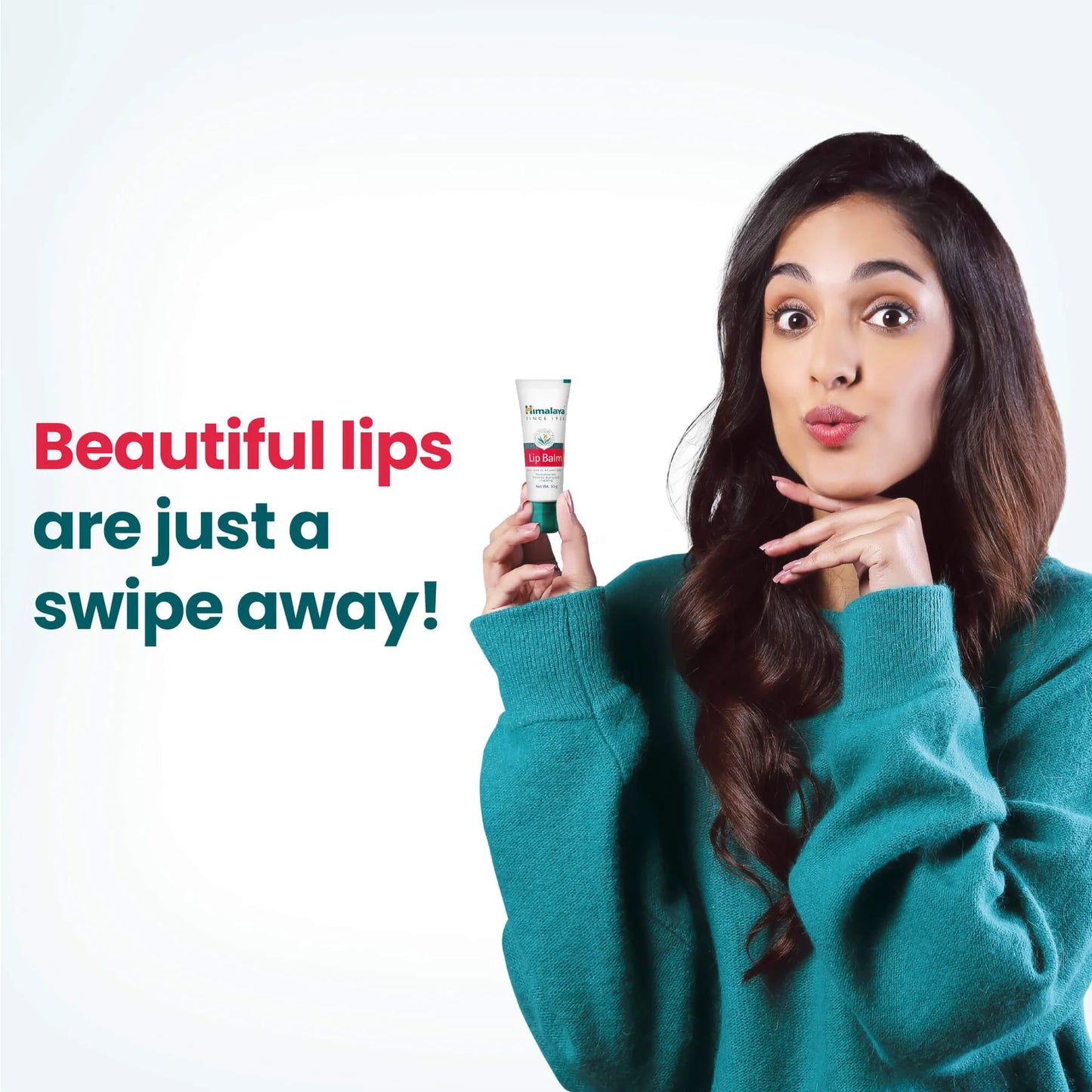 Woman holding a lip balm with text 'Beautiful lips are just a swipe away!' on a white background
