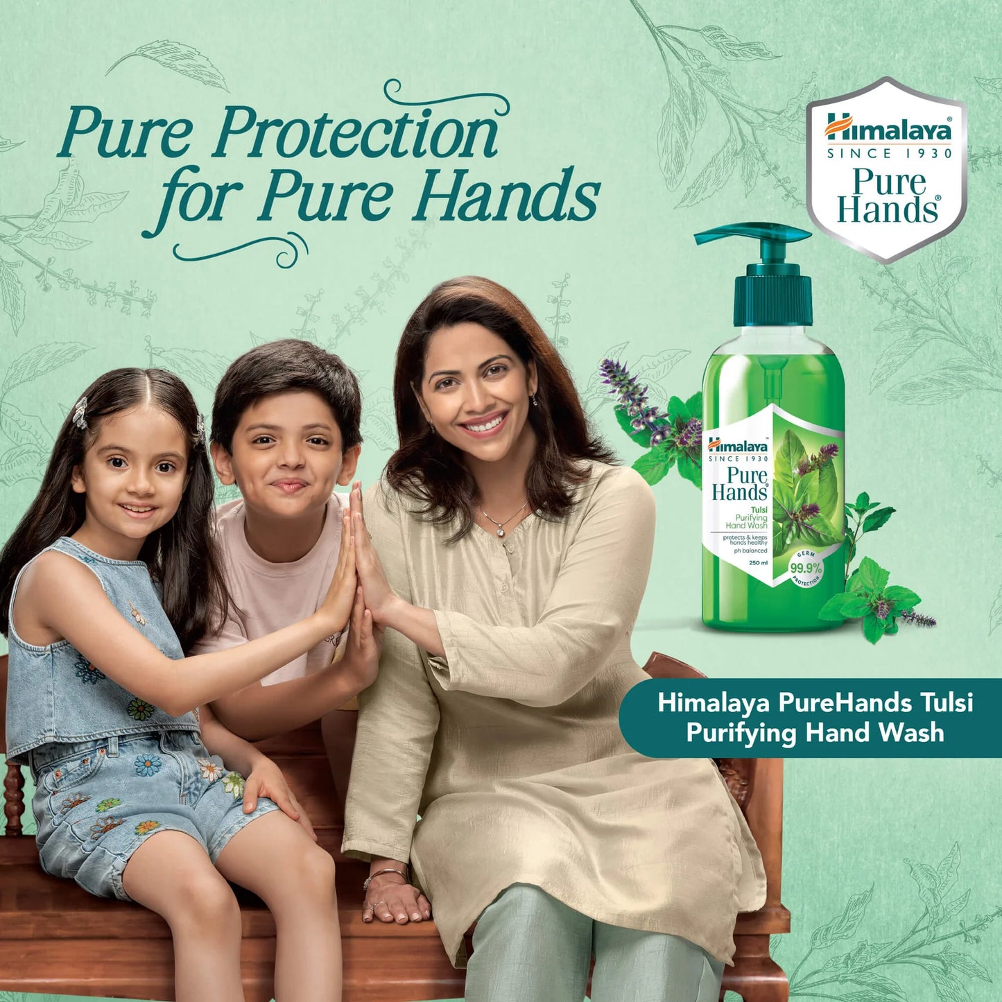Himalaya PureHands Tulsi Purifying Hand Wash with a family posing together on a bench.