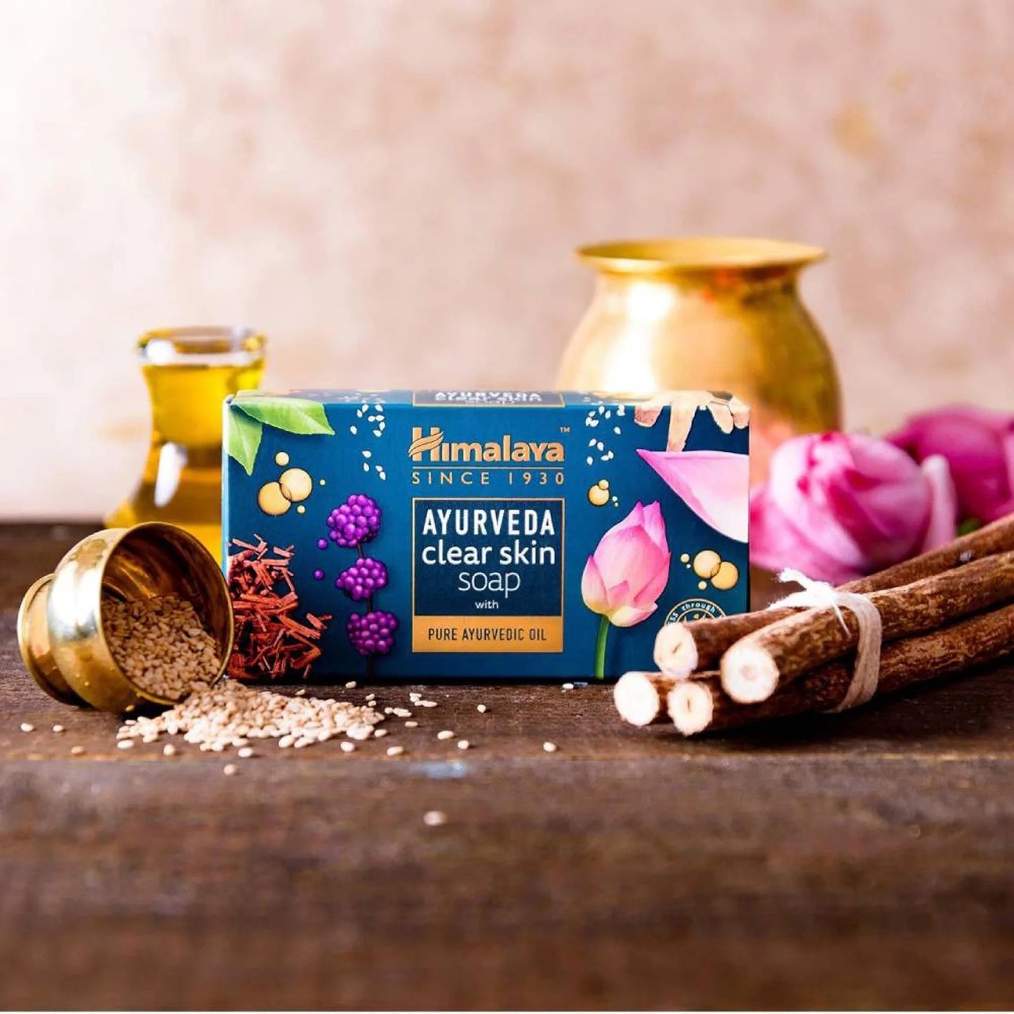 Himalaya Ayurveda clear skin soap on a wooden surface with decorative items.