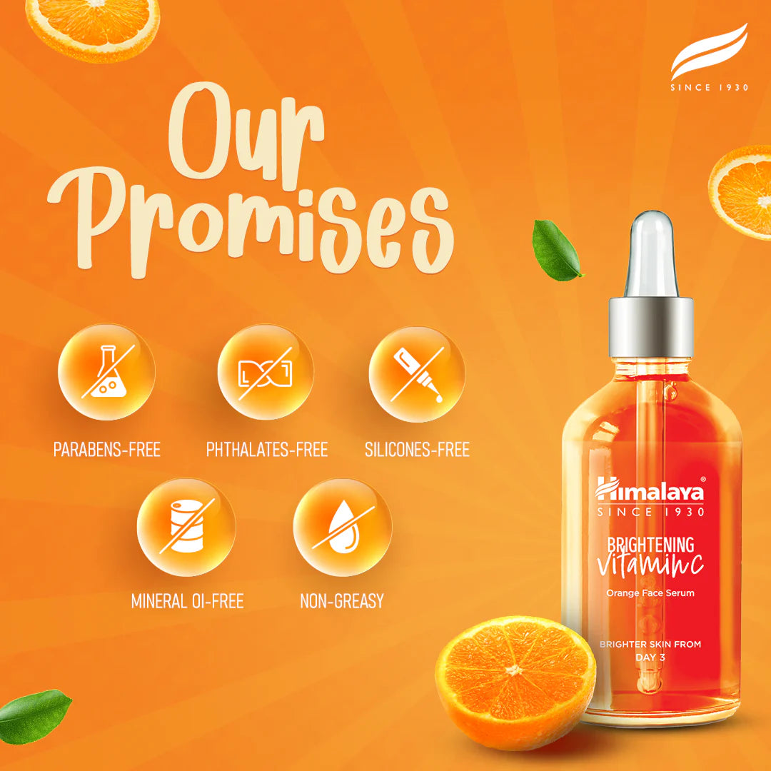 Himalaya Brightening Vitamin C Orange Serum with orange slices on an orange background